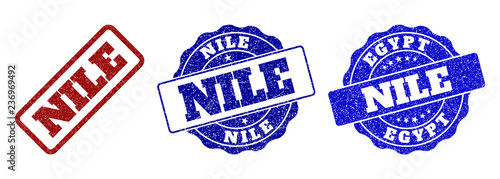 NILE grunge stamp seals in red and blue colors. Vector NILE watermarks with dirty style. Graphic elements are rounded rectangles, rosettes, circles and text tags. Designed for rubber stamp imitations.