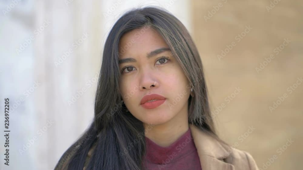 Asian sensual young woman staring at camera- outdoor-slow motion Asian sensual young woman staring at camera- outdoor-slow motion