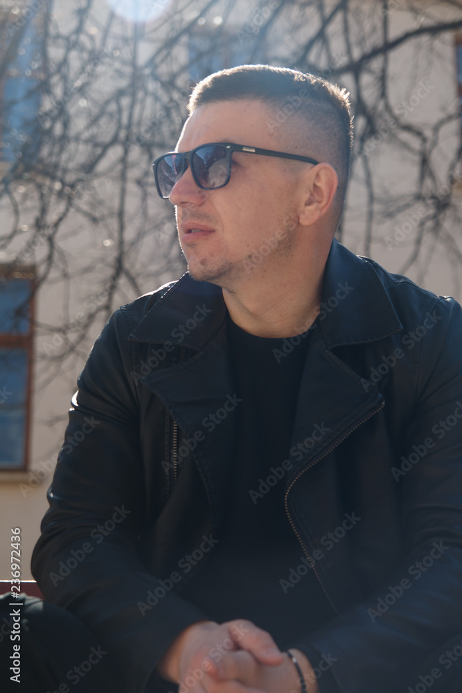 man in sunglasses on the background of architecture man in sunglasses on the background of architecture