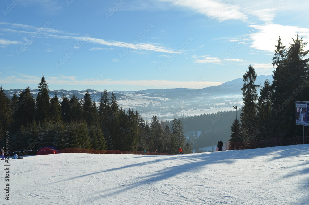 Fototapeta premium Snowy ski slope in Poland under the sun