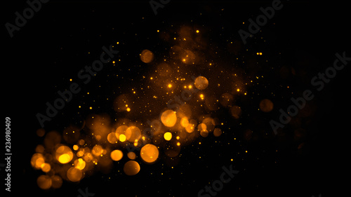 Gold abstract bokeh background. real dust particles with real lens flare stars. glitter lights . Abstract lights defocused. Merry Christmas and New Year feast.