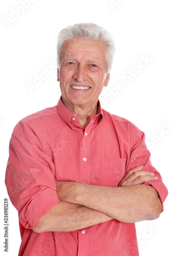 Senior man in pink shirt on white background