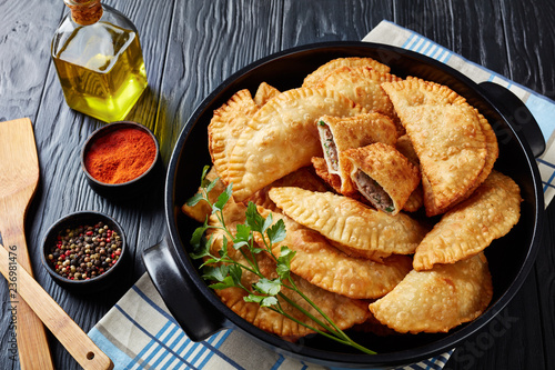 Canvastavla deep fried turnovers or chebureki, close-up