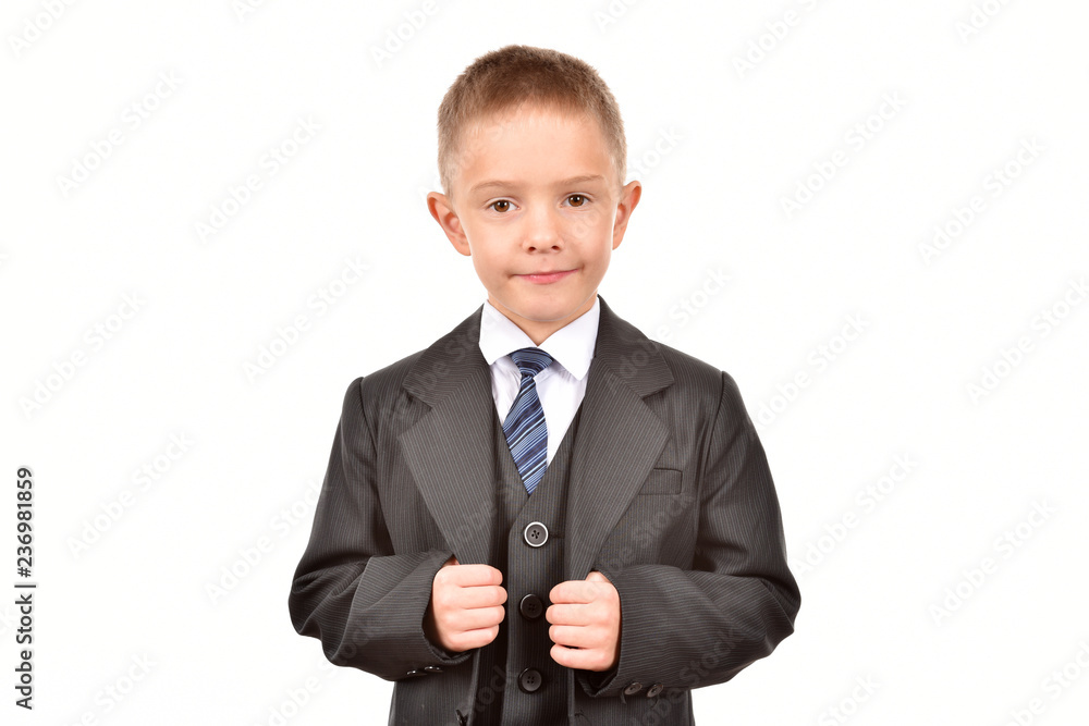 Boy in a suit on a white background. Happy childhood. Young businessman. Boy in a suit on a white background. Happy childhood. Young businessman.