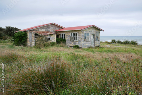 Fotografie Abandoned tumbledown seaside house