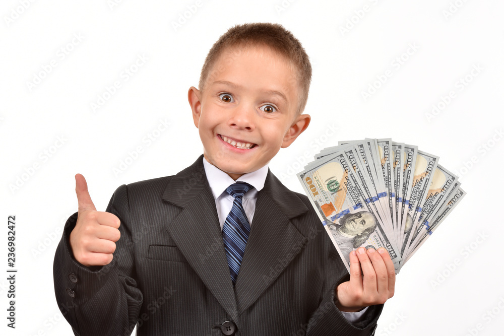 The boy holds dollars. Young businessman on a white background. The boy holds dollars. Young businessman on a white background.