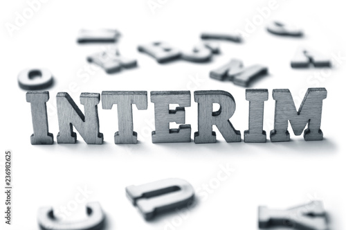 concept wooden word on white background - Interim