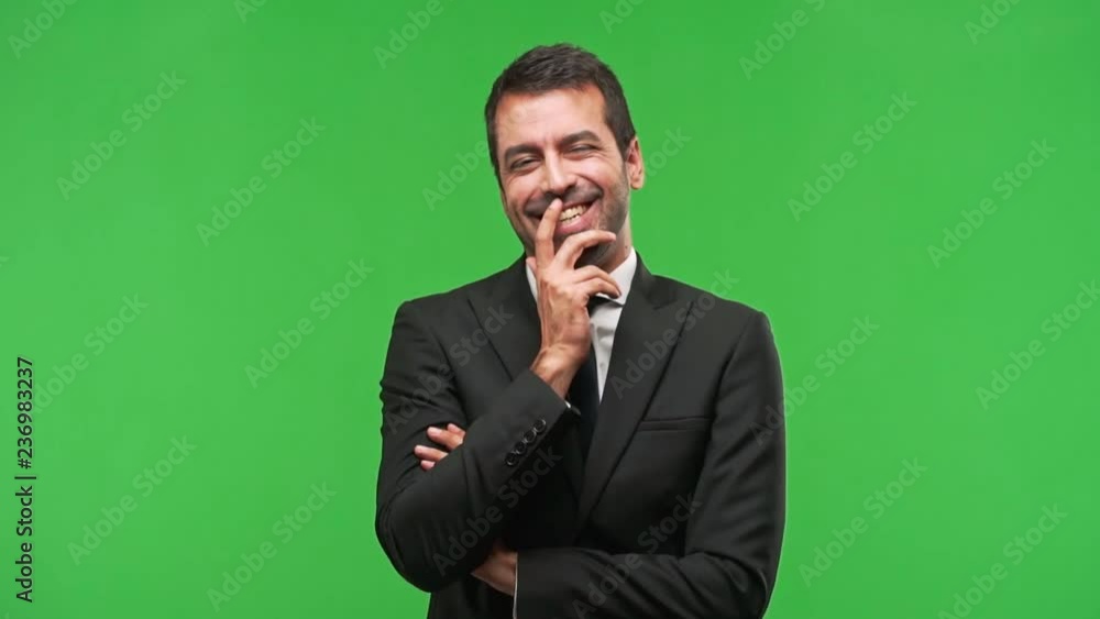 business man keeping the arms crossed while smiling business man keeping the arms crossed while smiling