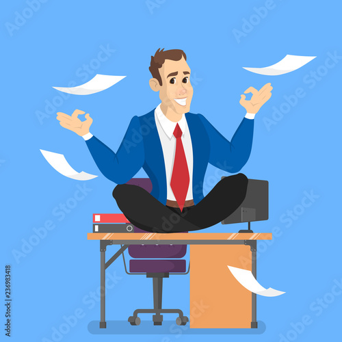 Businessman in lotus pose having break at work