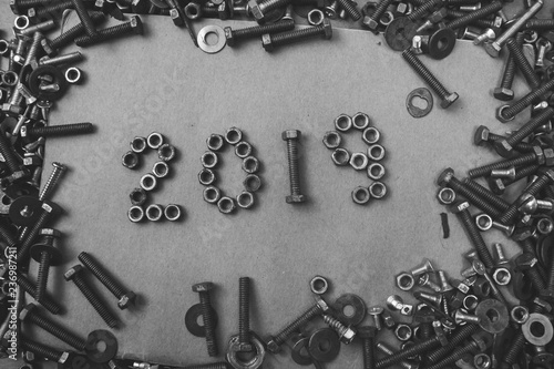 New year 2019 written with  metal nuts and bolts