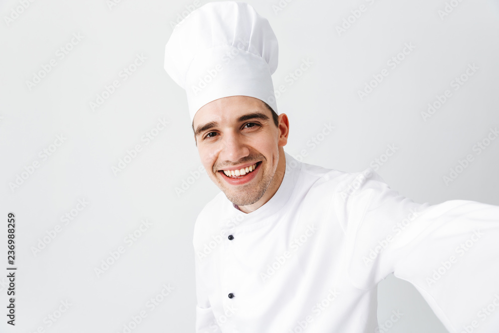 Happy chef cook wearing uniform standing Happy chef cook wearing uniform standing