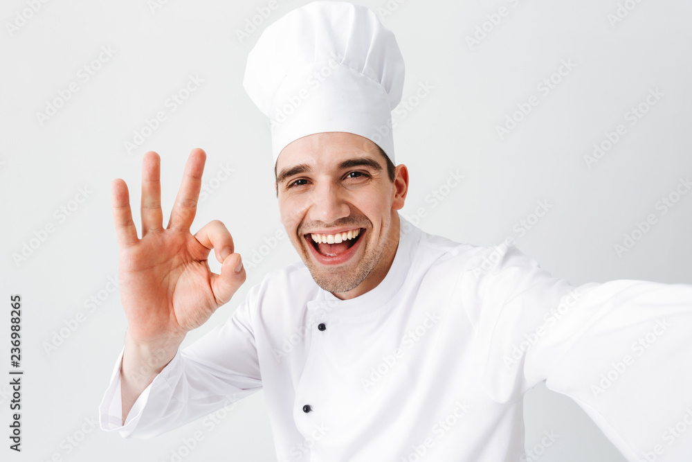 Happy chef cook wearing uniform standing Happy chef cook wearing uniform standing