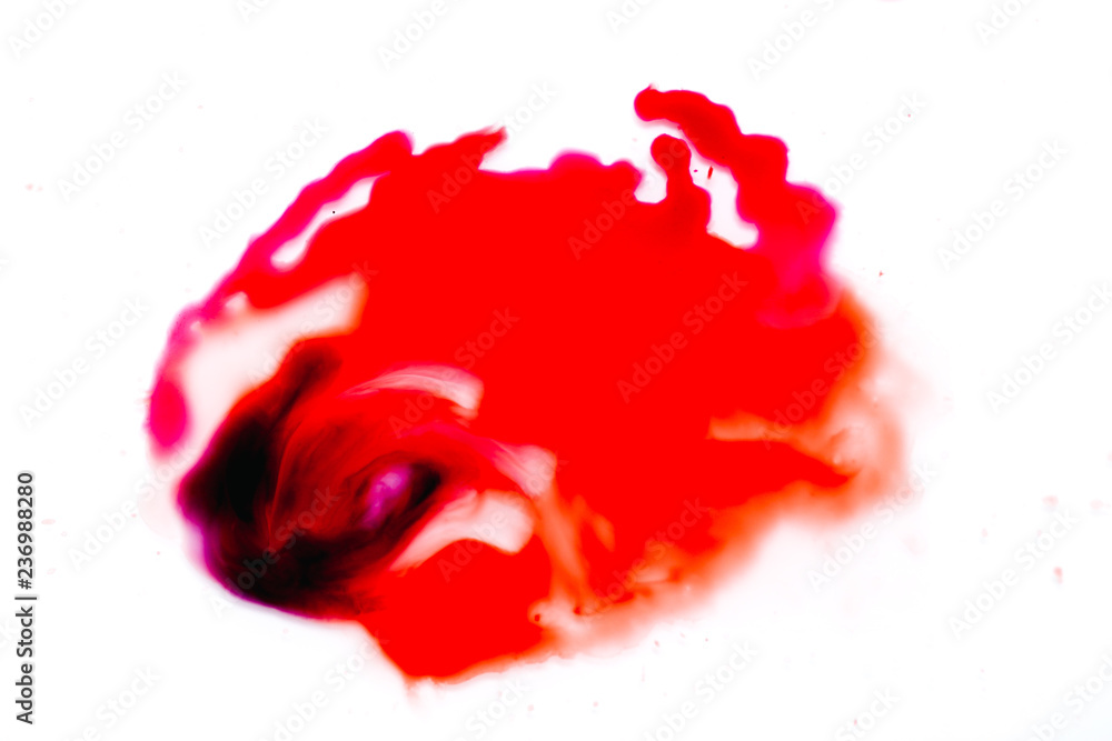 a spot of red paint on a white background. a spot of red paint on a white background.