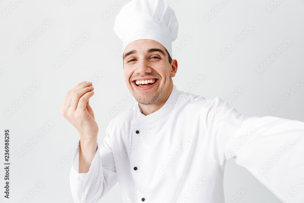 Happy chef cook wearing uniform standing Happy chef cook wearing uniform standing