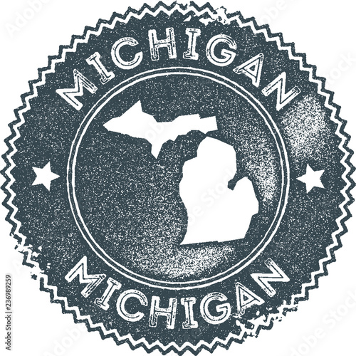 Michigan map vintage stamp. Retro style handmade label, badge or element for travel souvenirs. Dark blue rubber stamp with US state map silhouette. Vector illustration.