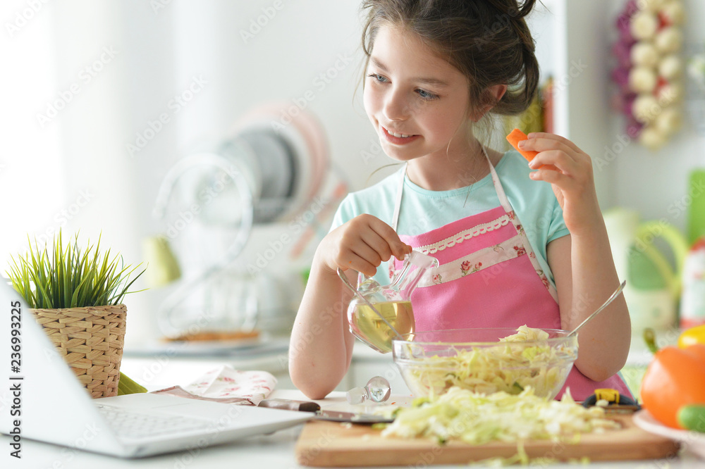 Portrait of girl cook to eat in the kitchen