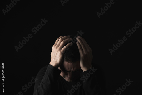 Принти на полотні desperate man with his hands in his head
