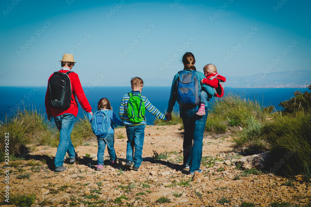 family with kids hiking travel together, Spain vacation, looking at view