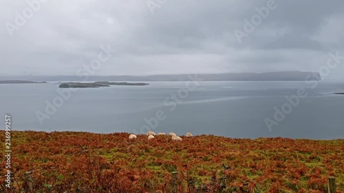 Isle of Skye, Scotland - View across Ardmore point towards distant Dunvegan Head with towering sea cliffs and the deep blue ocean photo