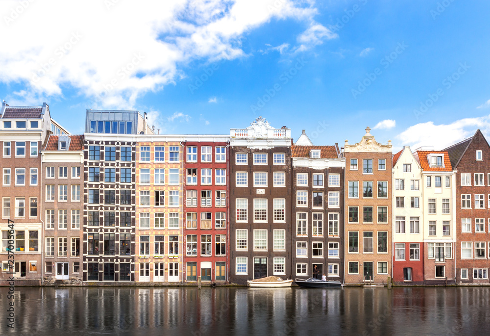 building of apartment along river or canal for tourist, tour, cruise or ship transportation in Amsterdam in Netherlands Europe