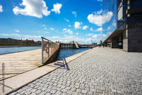 Photography Kalvebod bridge, wood  outdoor park near river and modern office in Copenhagen,