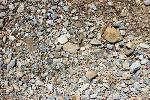 Gravel dirt road stones close up horizontal