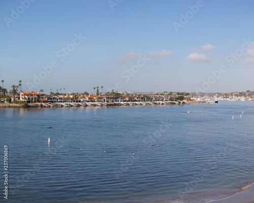 Southern California Coastline. View of the coastal access to the harbor from a rocky cliff. Corona Del Mar, Newport Beach, California Marina