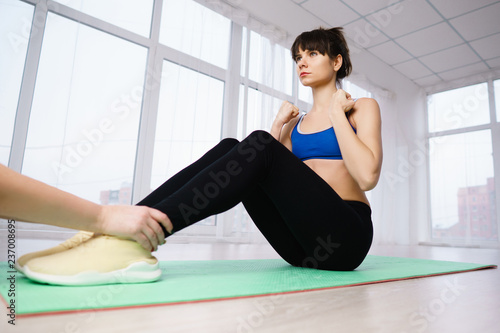 interval training, healthy lifestyle, sport, weight loss, tabata, endurance, perfect shape. Sportswoman doing abdominal crunches to get six-pack abs photo