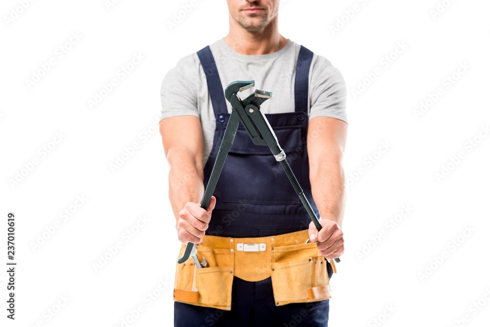 cropped view of woker holding pipe wrench isolated on white cropped view of woker holding pipe wrench isolated on white
