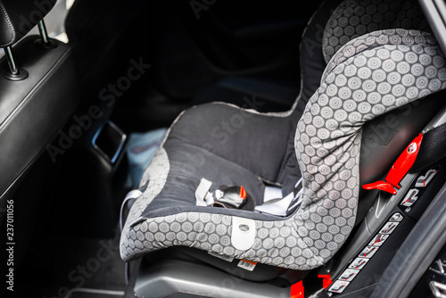 Child safety seat in the back of the car. Baby car seat for safety. Car interior. Car detailing. Child safety concept