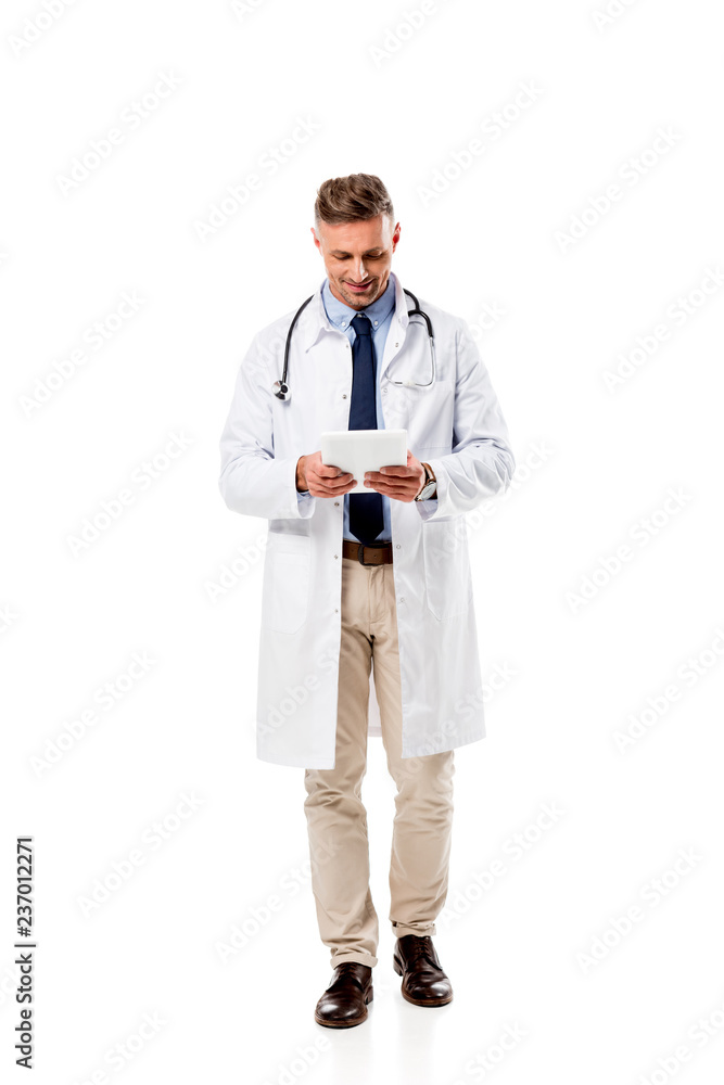 smiling doctor using digital tablet isolated on white smiling doctor using digital tablet isolated on white