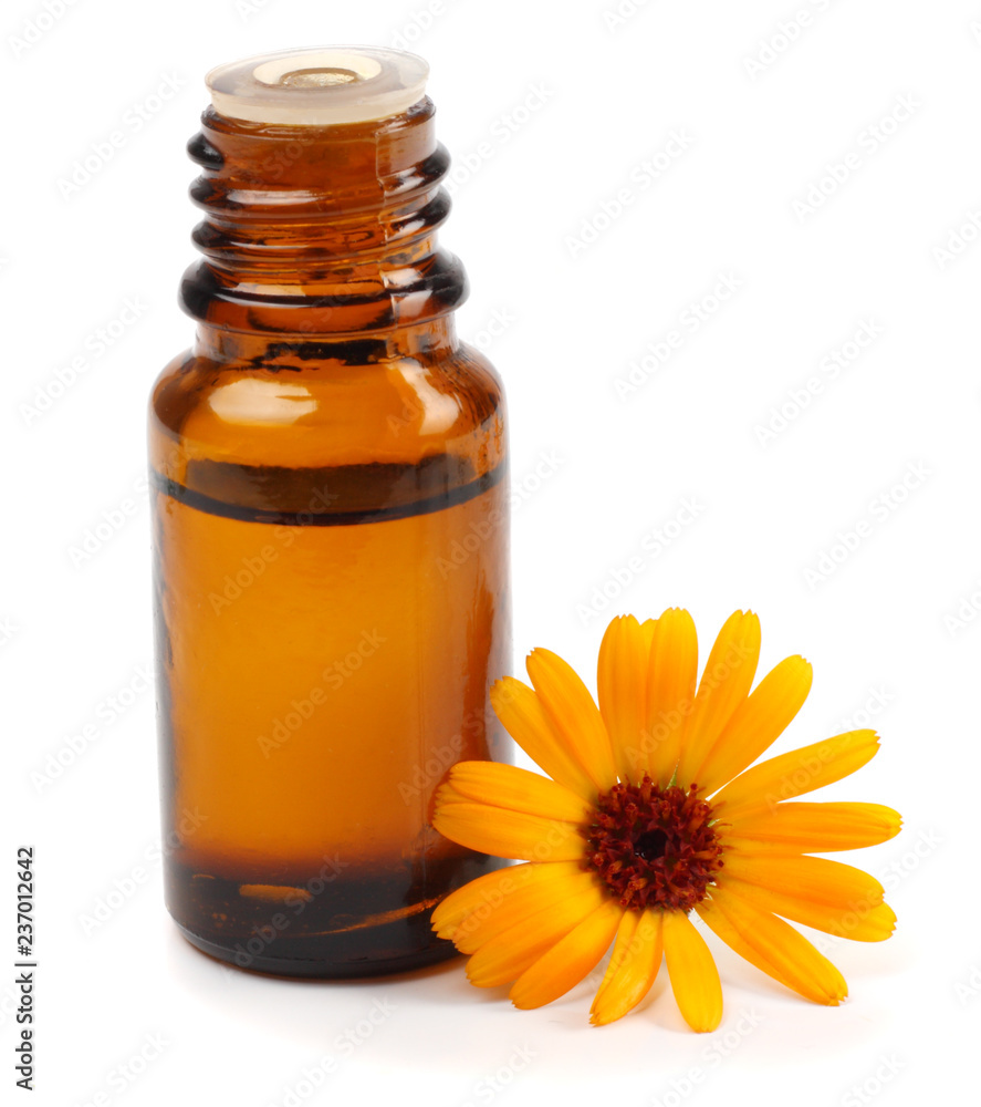 Oil and calendula flowers isolated on white Oil and calendula flowers isolated on white