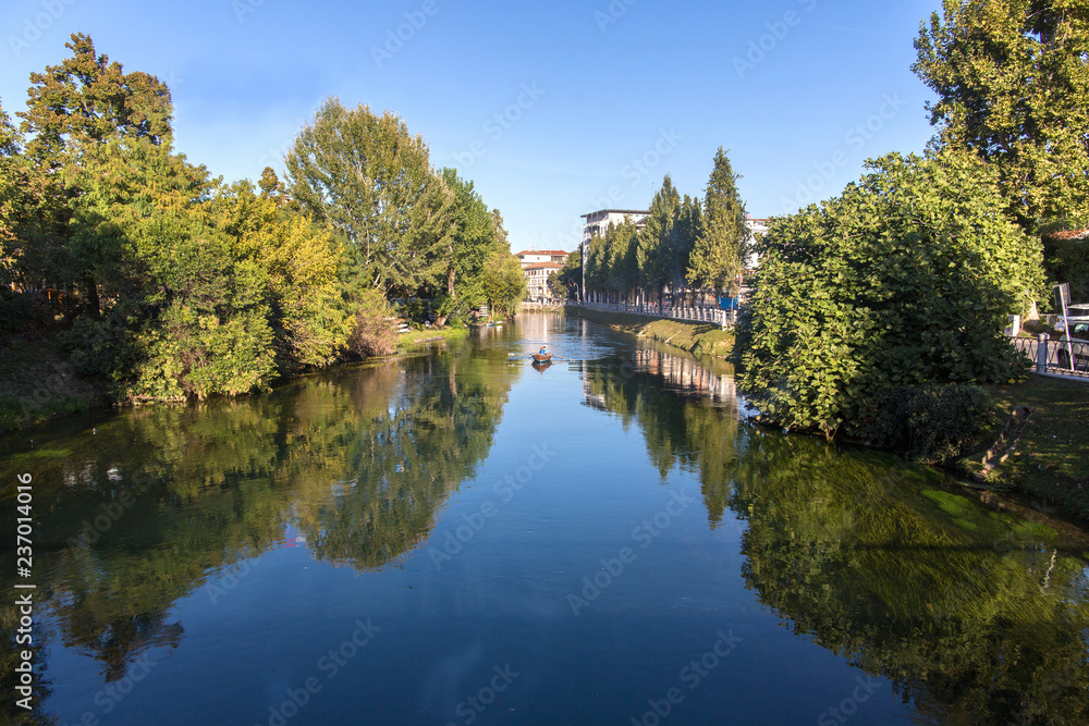 Treviso, Italy - September 27, 2018. Cagnan river in Treviso. View of the city of Treviso Treviso, Italy - September 27, 2018. Cagnan river in Treviso. View of the city of Treviso