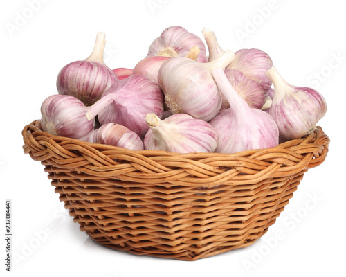 Garlic in a basket isolated on white photo