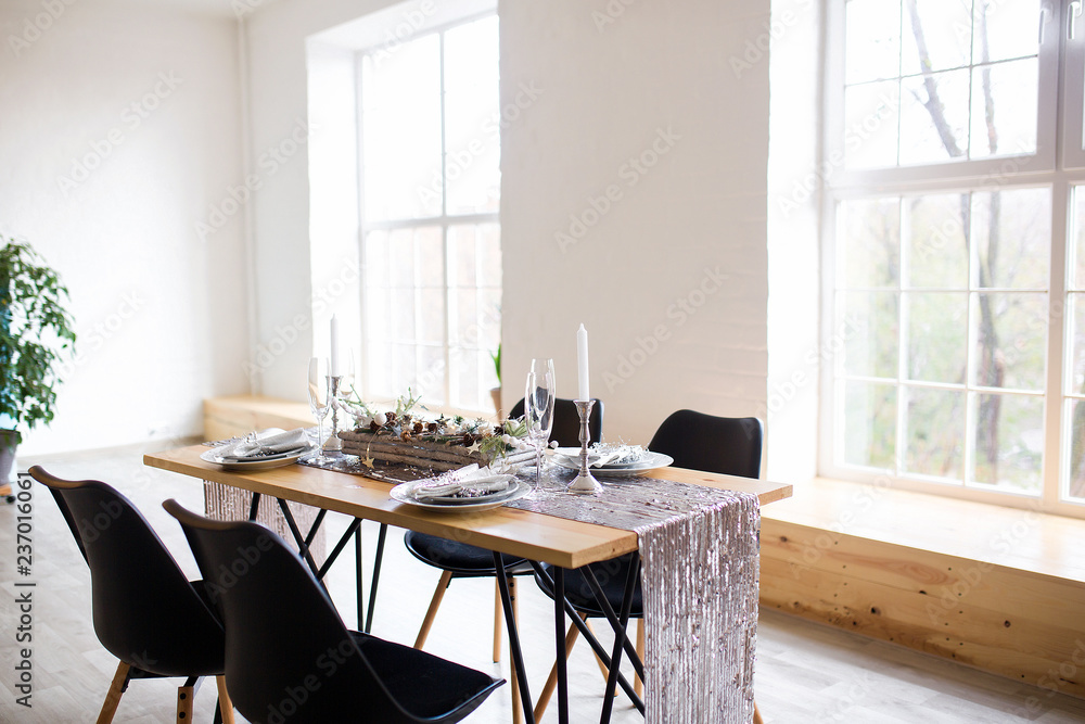 Fototapeta premium Table setting with holiday decorations. Preparation for christmas dinner