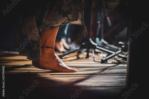 woman feet playing musica at folk fest