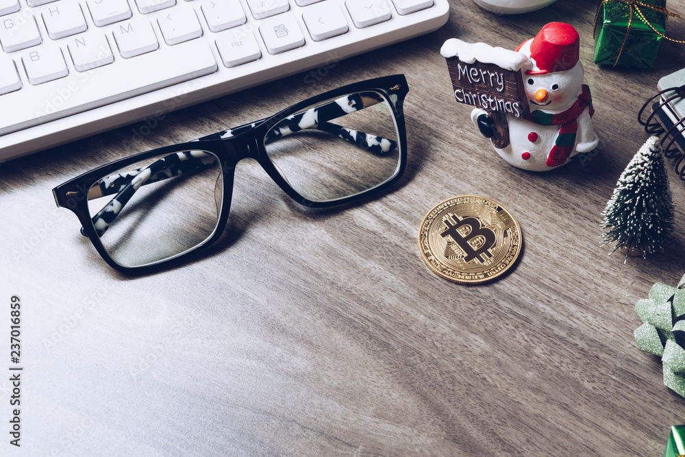 Merry Christmas and Happy new year Bitcoin cryptocurrency still life background concept. Crypto currency bitcoin on a Christmas background. Merry Christmas and Happy new year Bitcoin cryptocurrency still life background concept. Crypto currency bitcoin on a Christmas background.