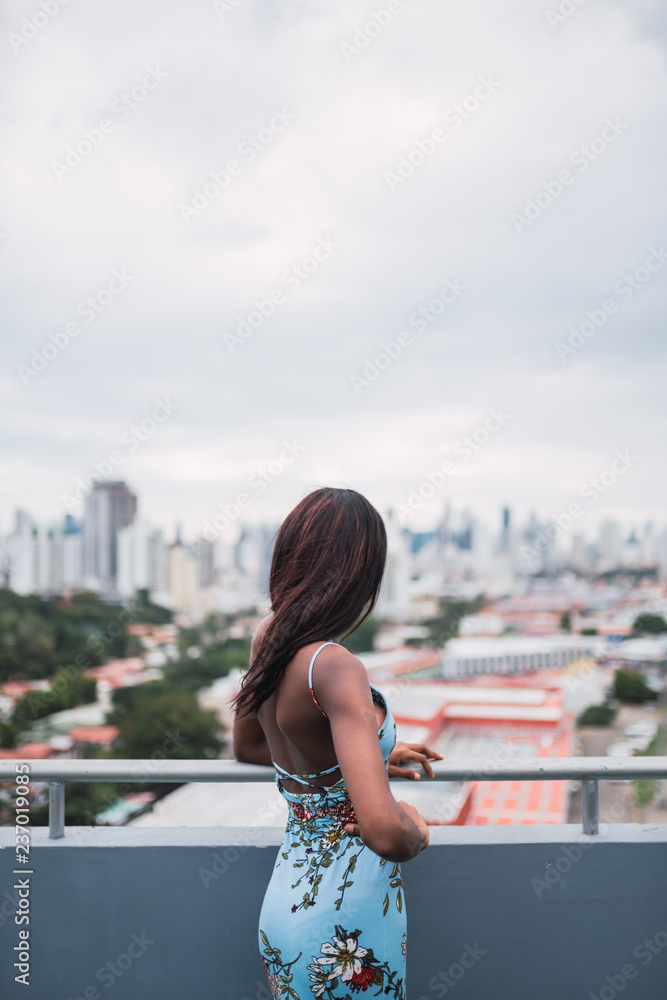 Dreaming woman on panorama of city