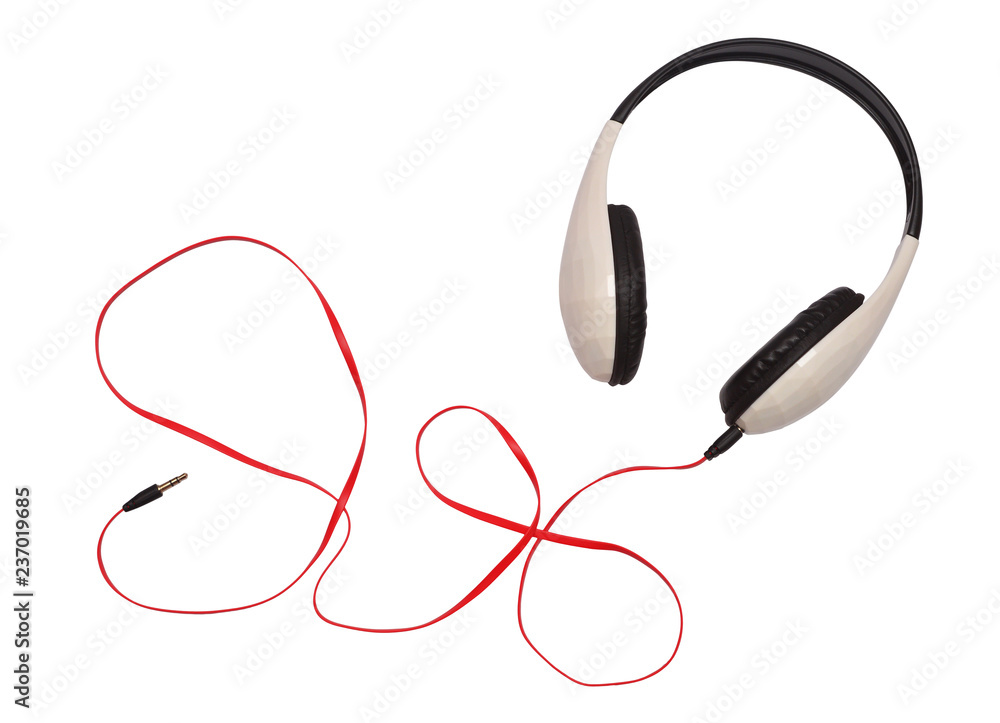 Headphones and cable isolated on white background. Flat lay, top view Headphones and cable isolated on white background. Flat lay, top view