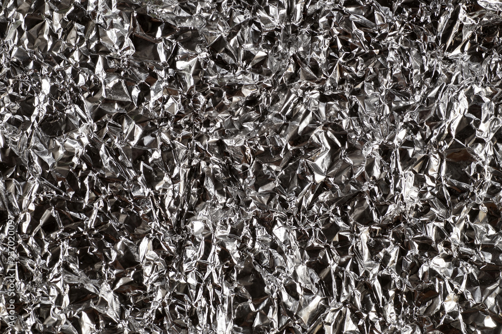Metallic and contrasting background obtained from crumpled aluminum foil. Metallic and contrasting background obtained from crumpled aluminum foil.