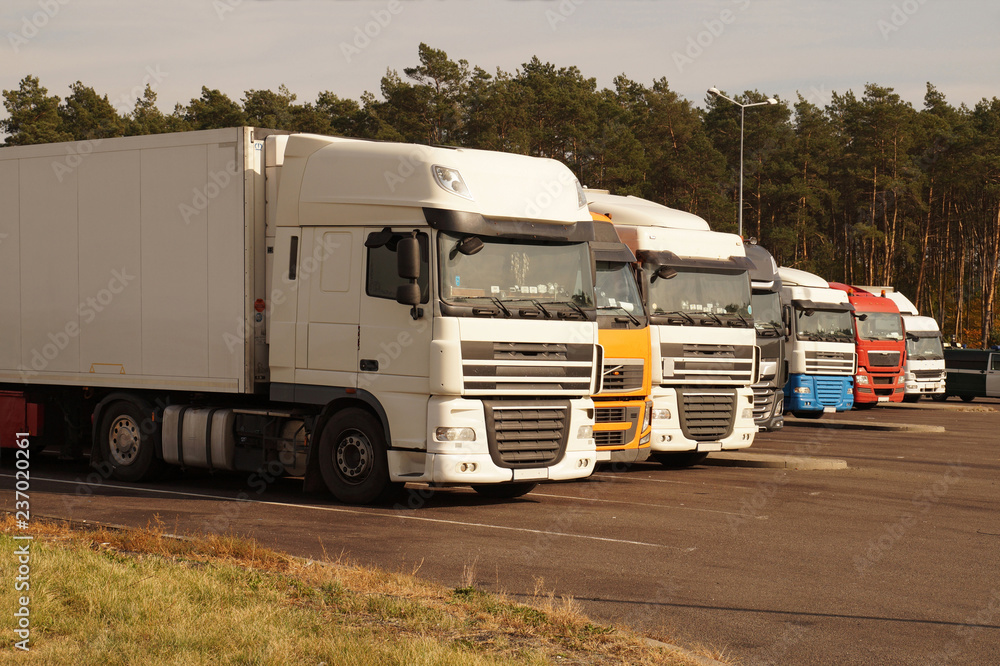 Road parking. Trucks set in a row on the driver's rest area.