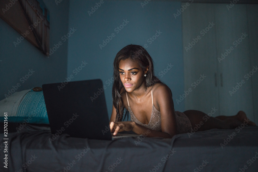 Chilling woman with laptop on bed Chilling woman with laptop on bed
