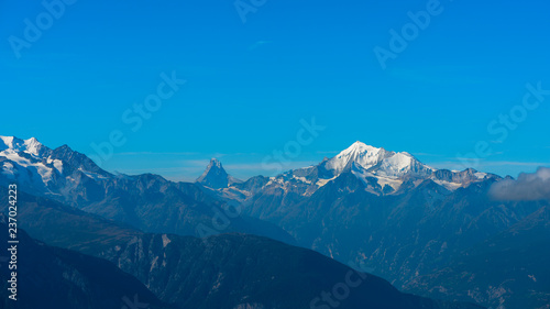 View on Matterhorn and Weisshorn mountain peaks from a distance. Swiss Alps