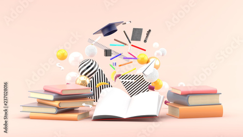 School Supplies Floating out of a book amidst colorful balls on a soft pink background.-3d render..