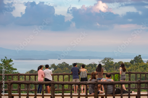 Tourists watch view  Srinakarin Dam at Huay Mae khamin waterfall National Park ,Kanchana buri in Thailand. photo