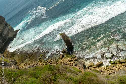 rocky coast, Uluwatu beach, Bali photo