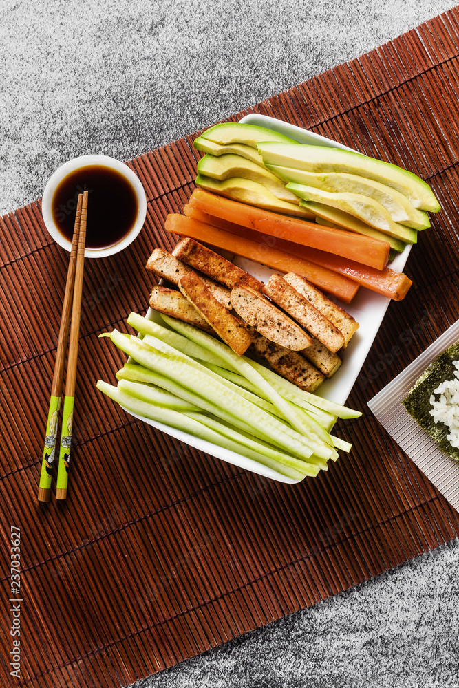 cooking healthy vegan sushi rolls on the table