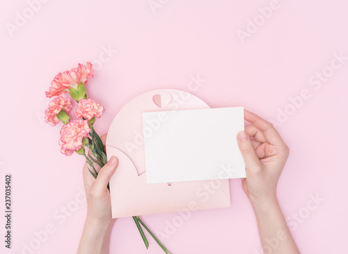 female hand hold flower with letter