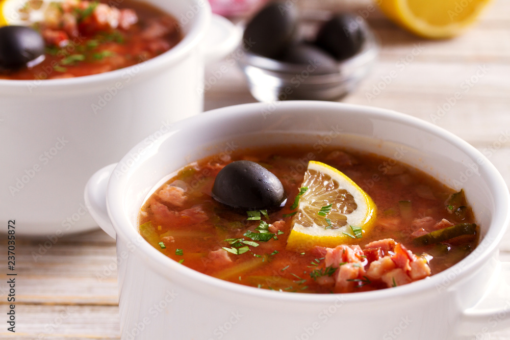 Traditional Russian dish solyanka - thick, spicy and sour saltwort soup Traditional Russian dish solyanka - thick, spicy and sour saltwort soup
