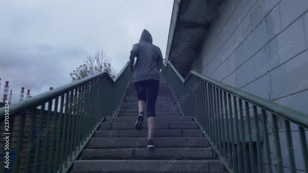 girl runs up the stairs, industrial background girl runs up the stairs, industrial background